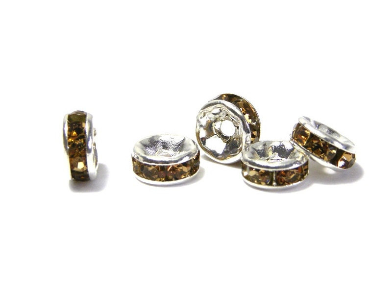 6 mm Silver plated Round A-Grade Rhinestone Spacers, Strass Rondelles - Light Colorado Topaz - 10 pc 6 mm Silver plated Round A-Grade Rhinestone Spacers, Strass Rondelles - Light Colorado Topaz - 10 pc